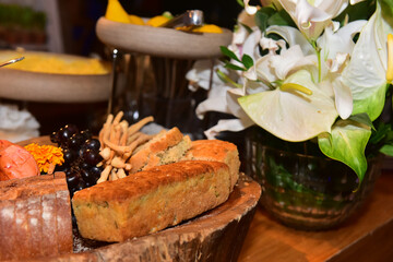 basket with bread, close-up of bread, buffet, table with food, table with bread, breakfast table, breakfast, flowers pot, flowers vase, white flowers, nature flowers
