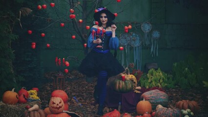 Ancient enchanted forest, medieval fantasy woman witch holds antique vintage candlestick in hand, candles burning, solidified red wax. Backdrop autumn tree branches, fruits apples. Halloween holiday - Powered by Adobe