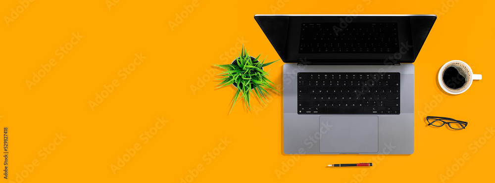 Poster top view flat lay work desk table business concept with computer laptop pen glasses white cup of cof