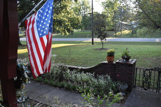 American Flag on the Front Porch of a House