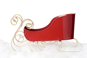 closeup metal santa sleigh with gold runners on snow - 529831280