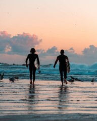 surfers on the beach 