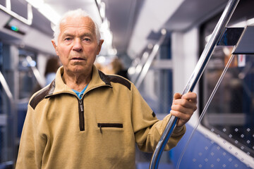 Elderly man in subway train