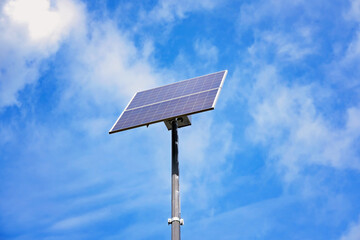 Solar panels on lampposts. Renewable energy sources in the countryside.