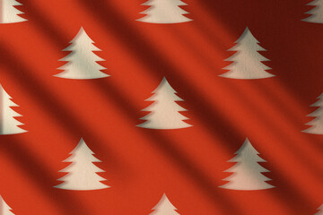 Christmas illustration design of christmas trees as pattern on red wall. Minimal pattern. Funny and colorful textured background with copy space.