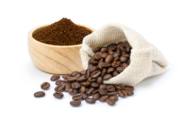 Roasted coffee beans in sack bag with coffe powder (ground coffee) in wooden bowl isolated on white...
