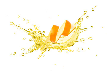 Orange essential oil splash with orange peel isolated on white background.