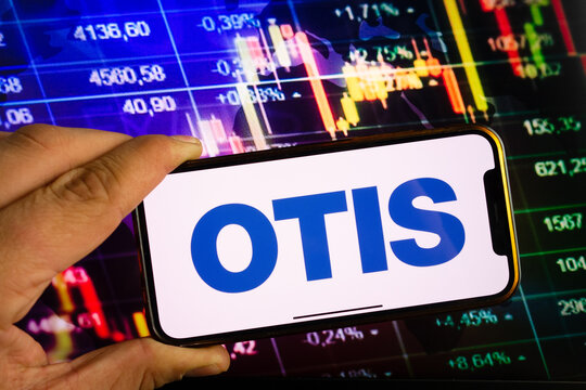 KONSKIE, POLAND - September 10, 2022: Smartphone displaying logo of Otis Worldwide company on stock exchange chart background