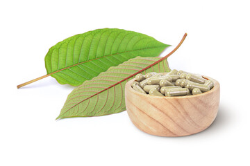Kratom leaves (Mitragyna speciosa) with kratom capsule isolated on white background. 