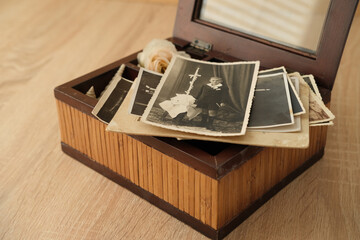close-up old vintage photos 50s, 60s sepia color in brown wooden box, chest, concept of antique...
