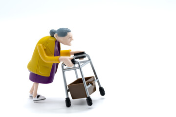 Grandmother with walker, toys, white background, cropped image
