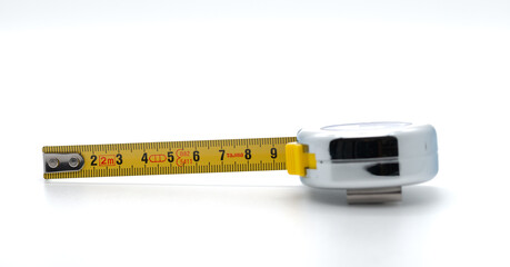 Tape measure for measuring, white background, cropped image