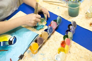 Drawing lesson. Children learn to draw with gouache
