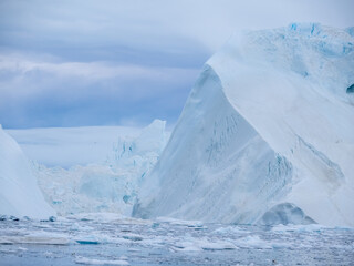 Awe-inspiring icy landscapes at the mouth of the Icefjord glacier (Sermeq Kujalleq), one of the fastest and most active glaciers in the world. Disko Bay, Ilulissat, Greenland