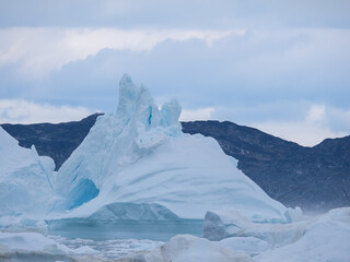 Awe-inspiring icy landscapes at the mouth of the Icefjord glacier (Sermeq Kujalleq), one of the fastest and most active glaciers in the world. Disko Bay, Ilulissat, Greenland