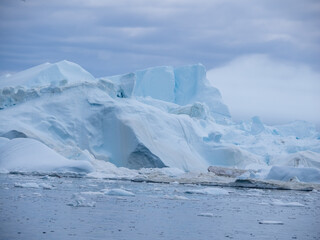 Awe-inspiring icy landscapes at the mouth of the Icefjord glacier (Sermeq Kujalleq), one of the fastest and most active glaciers in the world. Disko Bay, Ilulissat, Greenland