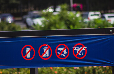 prohibition signs stadium entrance no food no guns no drone