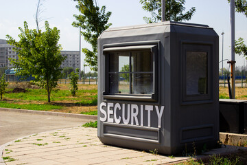 Green security booth in front the park entry