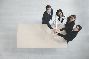 Group of young colleague businessman and businesswoman celebrate successful together in working office, Hands join together teamwork concept, Top view