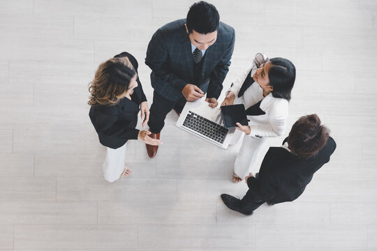 Group of young colleague businessman and businesswoman in formal suit working together at modern office, Top view