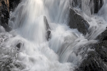 Fototapeta na wymiar Fast cascade in a remote region of Maine