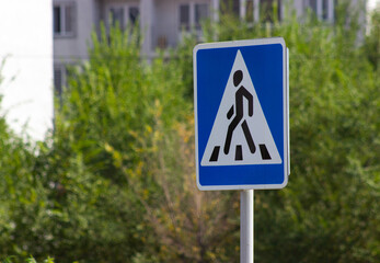 Pedestrian triangle road sign blue background