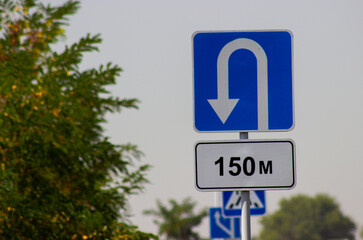traffic direction sign white reverse arrow on blue background