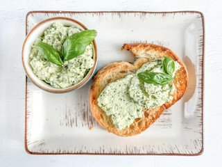 Greek appetizer paste spread on toast bread on plate - obrazy, fototapety, plakaty