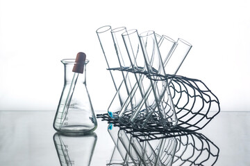 flask with lab glassware and test tubes in chemical laboratory background, science laboratory research and development concept