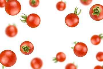 Levitation of cherry tomatoes isolated on white background.
