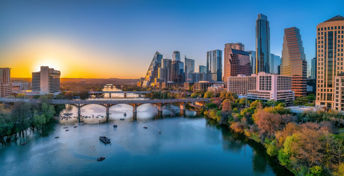 Austin, Texas- Cityscape with Colorado River in the middle against the sunset sky