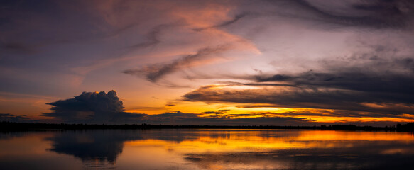 twilight Beauty Evening colorful clouds - sunlight with dramatic sky.Dramatic sky reflection in water.