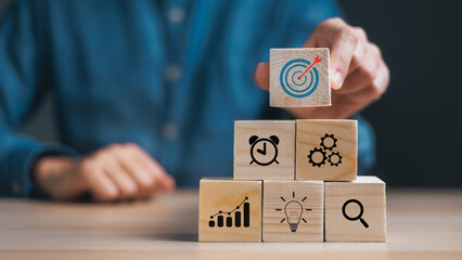 Business development Decide and choose concept. hand stack woods block step on table. copy space.