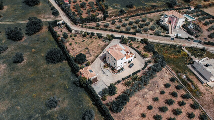 Big house arround a big forest with a lot of trees
