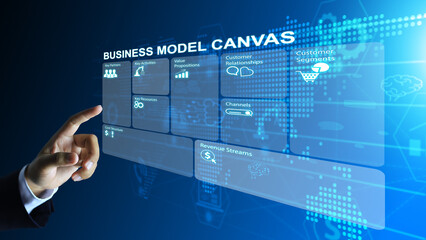 Hand extended to point, touch, and click to activate functions in a business plan or business model...