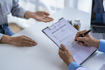 Doctor and patient consulting and diagnosis sitting at a table with advice of medicines to eat near window in hospital medical concept