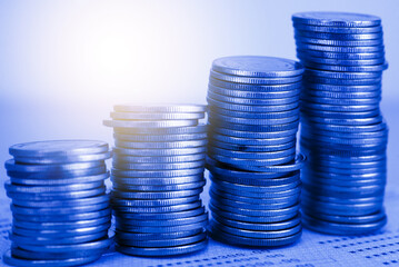 row of coin stack with double exposure background and light flare for financial banking and saving money and business stock investment concept. forex marketing trading.