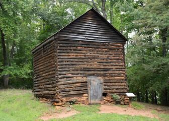 Historic old Virginia tobacco barn. Front and side view.