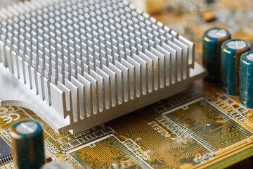 Old motherboard covered in dust and dirt. Close-up.