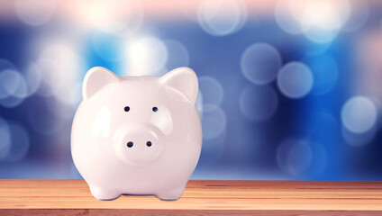 Pink piggy bank on table