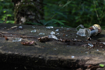 broken glass bottle in the park, resting place in the forest