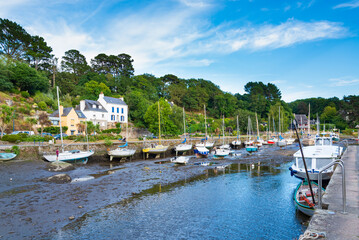 The small harbour in the small village of Pont Aven, Brittany, France, during low tide. Many...