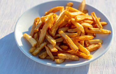 fried french fries on a white plate