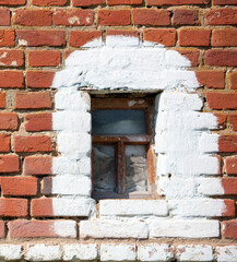 Windows on an old brick house.