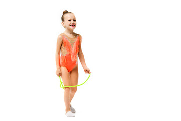 Happy female sporty child jump with rope