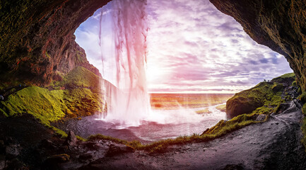 Incredible nature scenery of Iceland. Stunning view from the middle of  Seljalandsfoss waterfall...