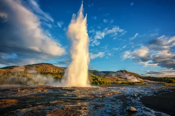 Impressive Eruption of Strokkur Geysir in Iceland during sunset. Strokkur Geyser Is one most popular nature landmark and travel destination Golden circle, Iceland © jenyateua