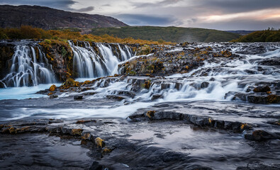 Fantastic Bruarfoss Waterfall. Amazing nature of Iceland. Iceland popular place of travel and touristic location. Wonderful Icelandik landscape during sunset. Creative image. Natural background