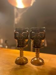 Skull glasses on a kitchen bar for a halloween house party 
