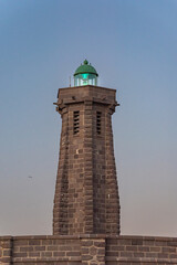 Small lighthouse at the entrance to the port of Melilla, pointing to one of the breakwaters that close the port.